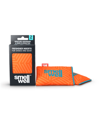 A package of SmellWell Active - Geometric Orange and 2 SmellWell Active - Geometric Orange freshener inserts bags next to it